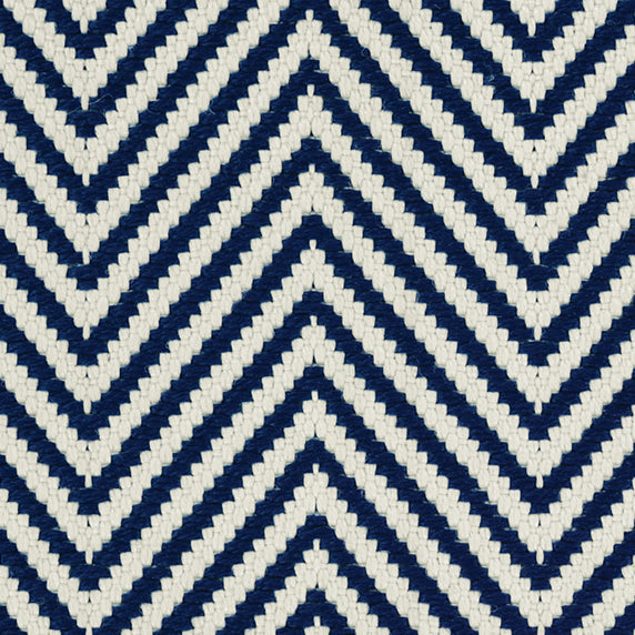Outdoor broadloom carpet swatch in a herringbone weave in navy and cream.