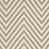 Outdoor broadloom carpet swatch in a herringbone weave in tan and cream.