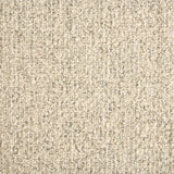 Wool broadloom carpet swatch in a textured high-pile weave in mottled tan.