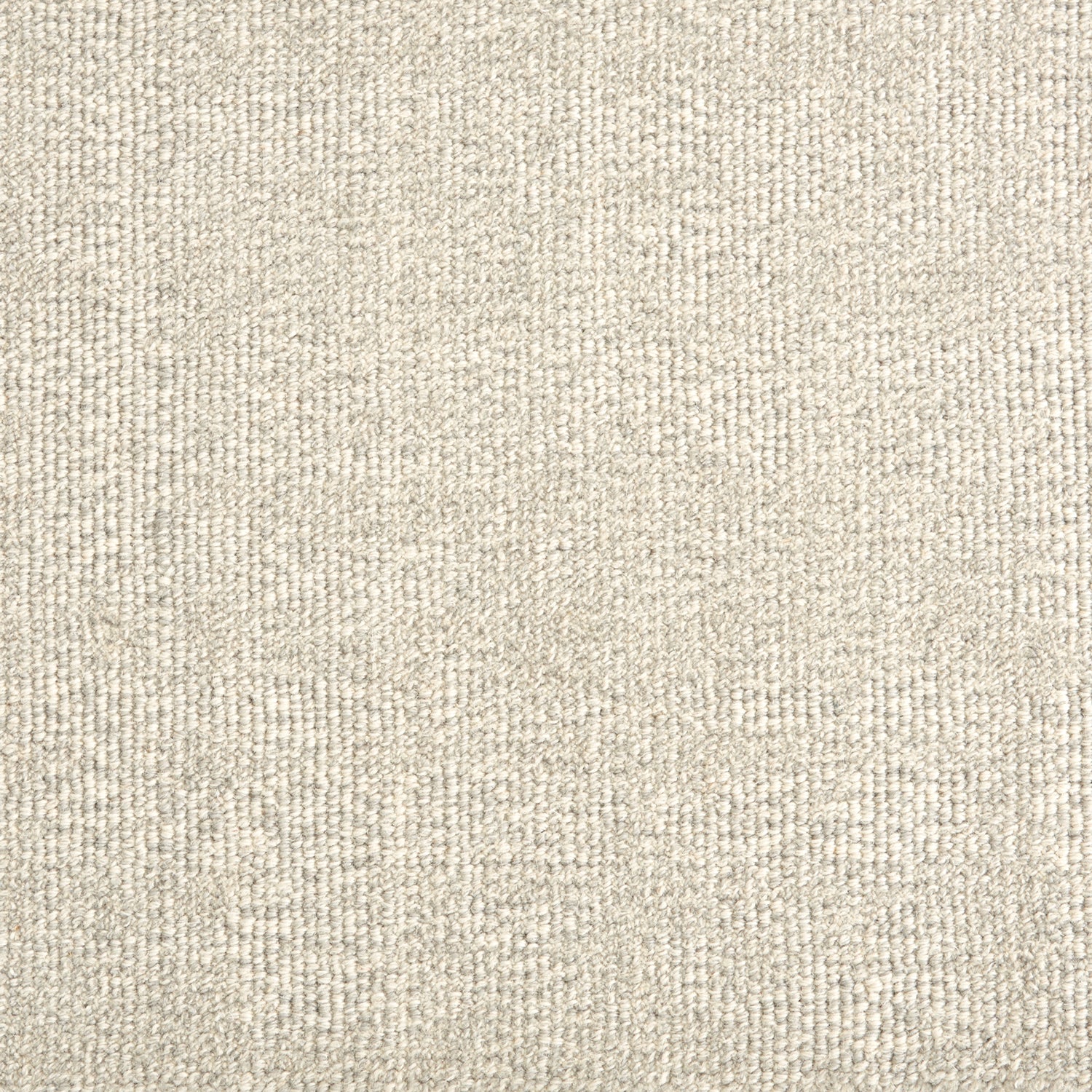Wool broadloom carpet swatch in a textured weave in mottled cream.