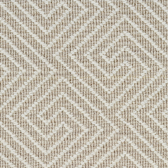 Wool broadloom carpet swatch in a high-pile interlocking geometric pattern in white and cream.