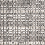 Wool broadloom carpet swatch in an abstract grid print in cream and gray.