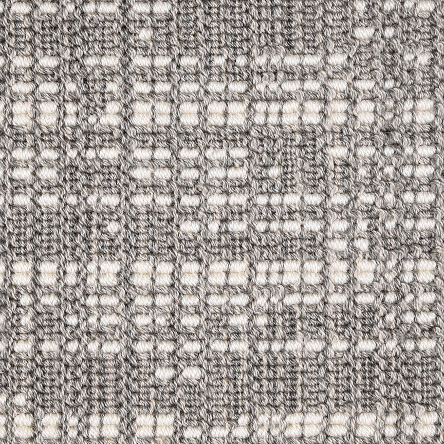 Wool broadloom carpet swatch in an abstract grid print in cream and gray.