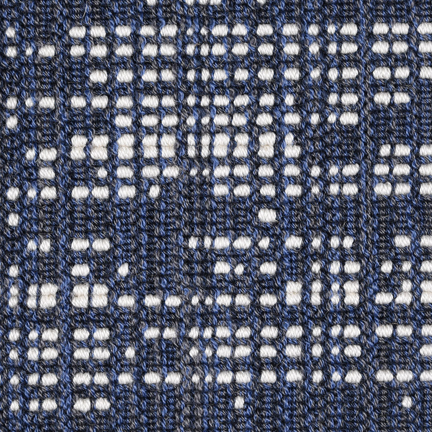 Wool broadloom carpet swatch in an abstract grid print in navy and cream.