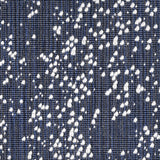 Wool broadloom carpet swatch in an irregular looped weave in black and navy with white accents.