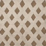 Rug swatch with a repeating tan diamond pattern on a high-pile white field.