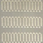Woven rug swatch with a repeating pattern of high-pile fringed stripes in cream on a gray field.