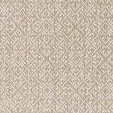 Wool-nylon broadloom carpet swatch in a geometric lattice print in cream and tan.