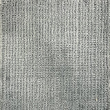 Nylon broadloom carpet swatch in a ribbed weave in grey.
