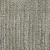 Nylon broadloom carpet swatch in a ribbed weave in silver.