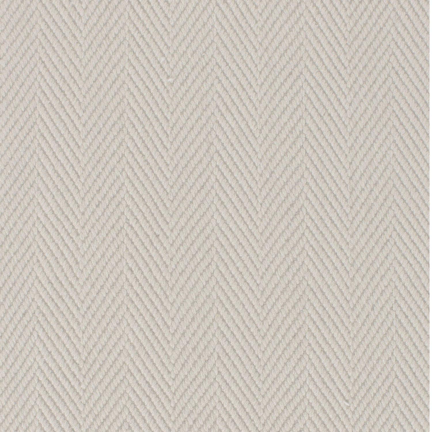 Wool broadloom carpet swatch in a herringbone weave in cream.