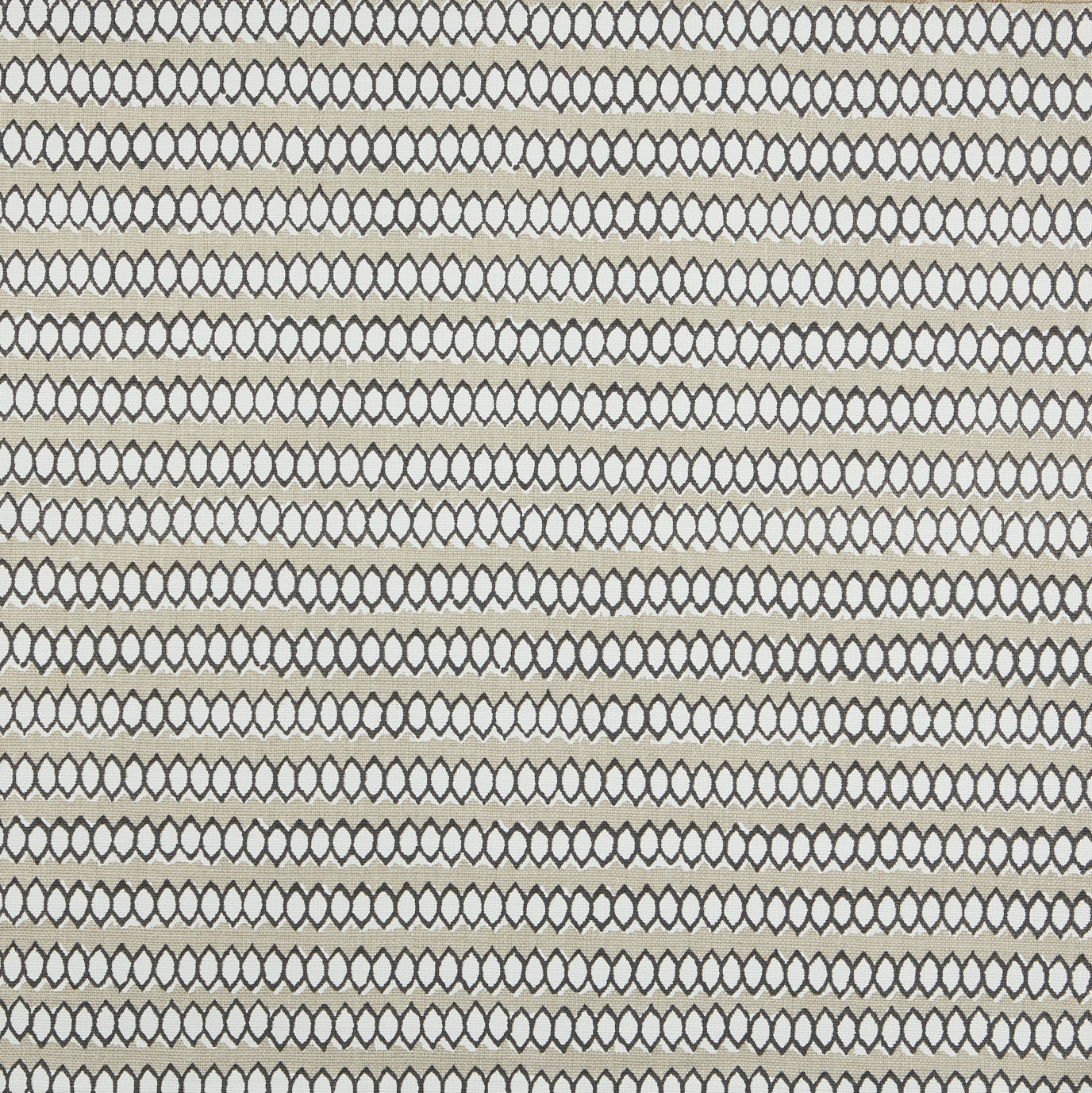 Swatch of fabric with rows of hand-drawn black and white honeycomb shapes on a tan background.