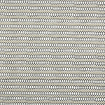 Swatch of fabric with rows of hand-drawn black and white honeycomb shapes on a tan background.