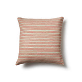 Square throw pillow in a striped pattern of hand-drawn red and pink honeycomb shapes on a cream background.