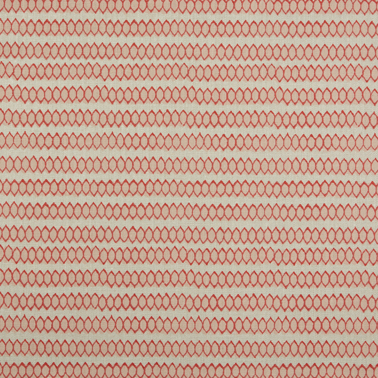 Swatch of fabric with rows of hand-drawn red and peach honeycomb shapes on a tan background.