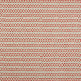 Swatch of fabric with rows of hand-drawn red and peach honeycomb shapes on a tan background.