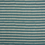 Swatch of fabric with rows of hand-drawn navy and turquoise honeycomb shapes on a cream background.
