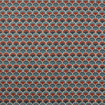 Swatch of fabric with a repeating Japanese-inspired scalloped pattern in shades of navy, blue and red. 