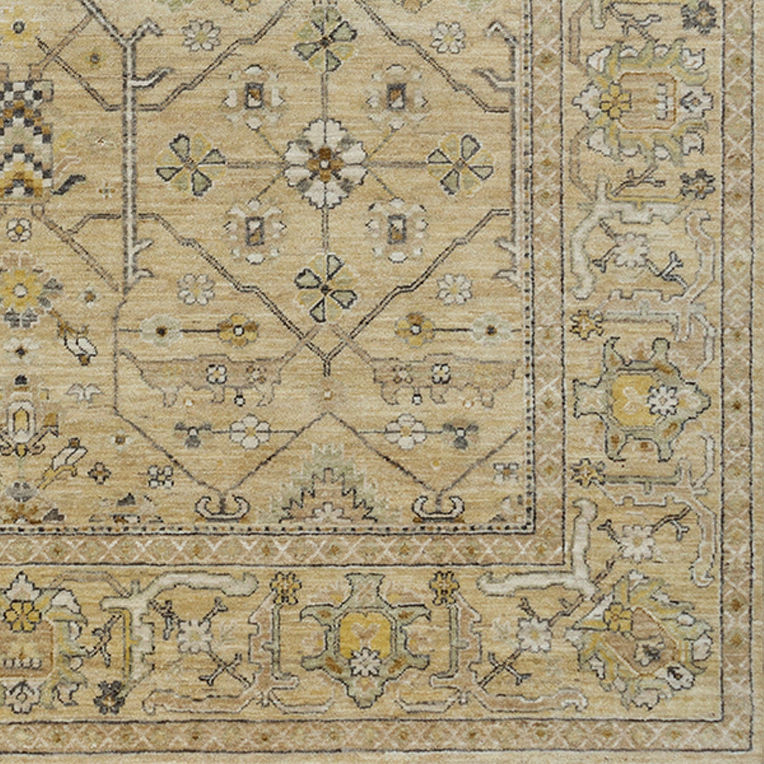 Rug swatch in a repeating geometric print with a floral border in shades of cream, gold and brown.