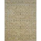 Large rectangular rug in a repeating geometric print with a floral border in shades of cream, gold and brown.
