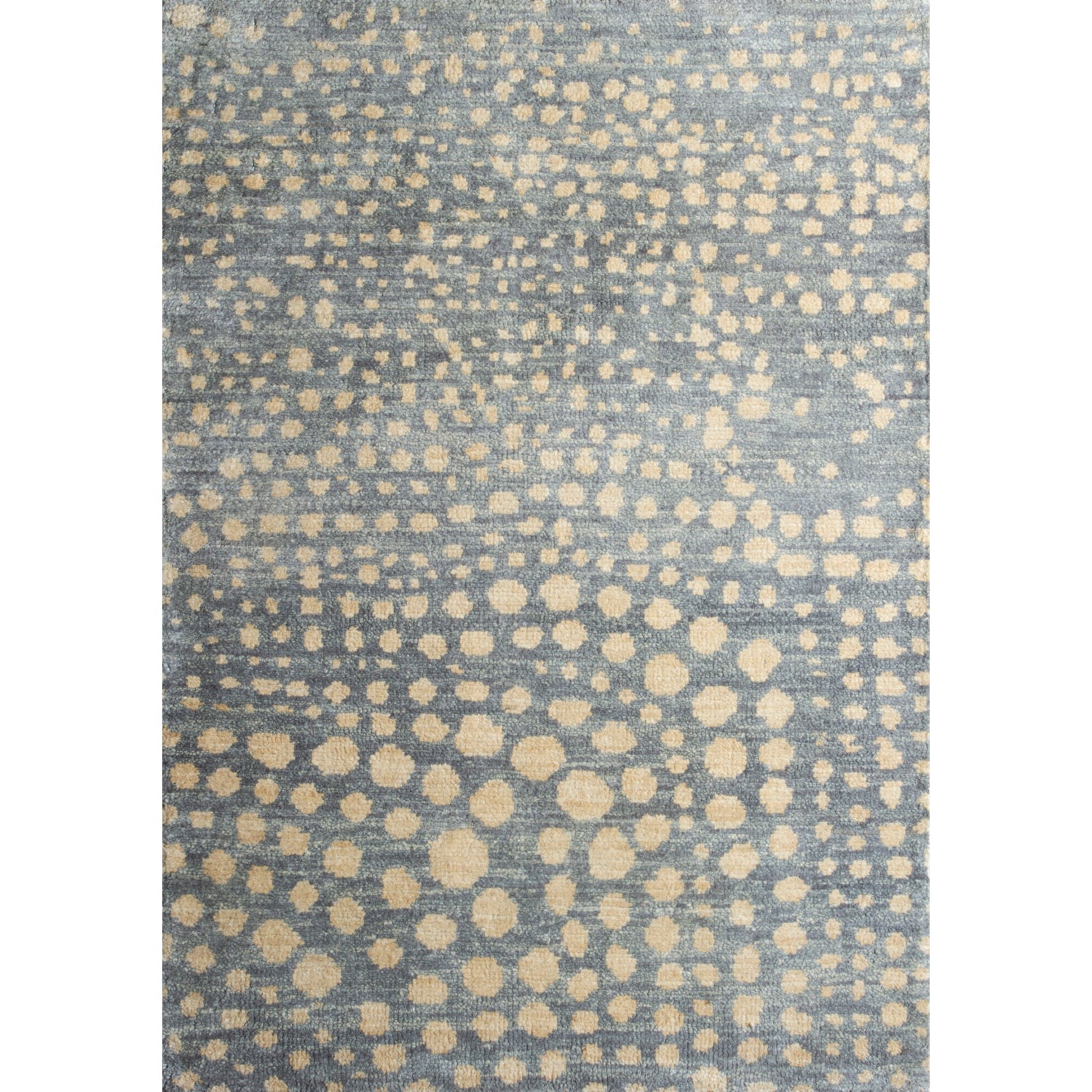 Large rectangular rug in a small-scale pattern of many repeating different-sized circles in tan on a blue-gray field.