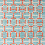 Woven rug swatch in an interlocking geometric buckle pattern in coral and white on a light blue field.