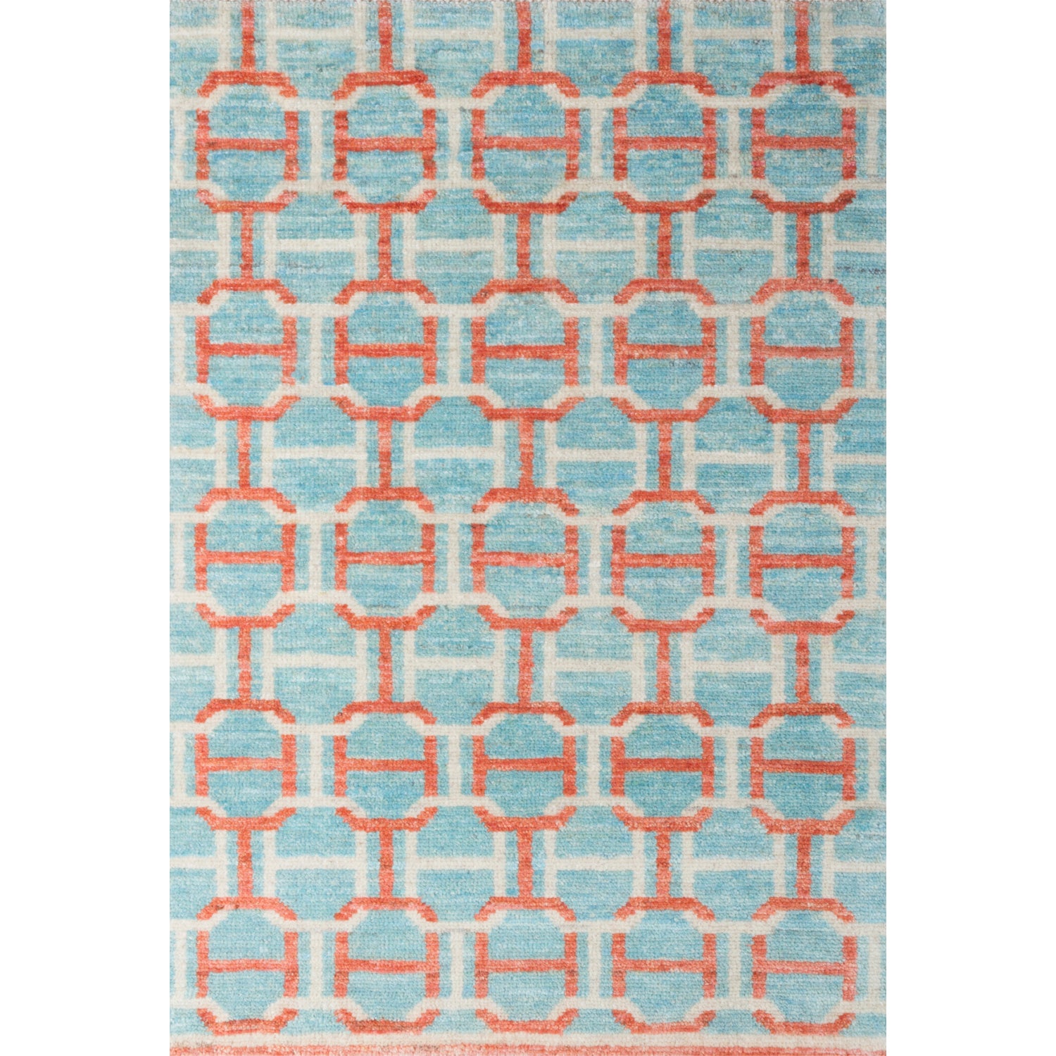 Large rectangular rug in an interlocking geometric buckle pattern in coral and white on a light blue field.