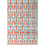Large rectangular rug in an interlocking geometric buckle pattern in coral and white on a light blue field.