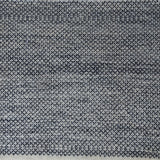 Woven rug swatch with a small-scale diamond pattern in black on a blue-gray field.