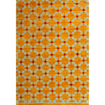 Rectangular rug in a large-scale grid pattern featuring squares of mustard, light blue and red.