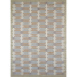 Rectangular rug in a stripe motif broken by rows of rectangular shapes in white and gray on a blue and tan field.