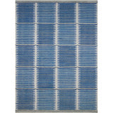 Rectangular rug in a stripe motif broken by rows of rectangular shapes in white on a blue and green field.