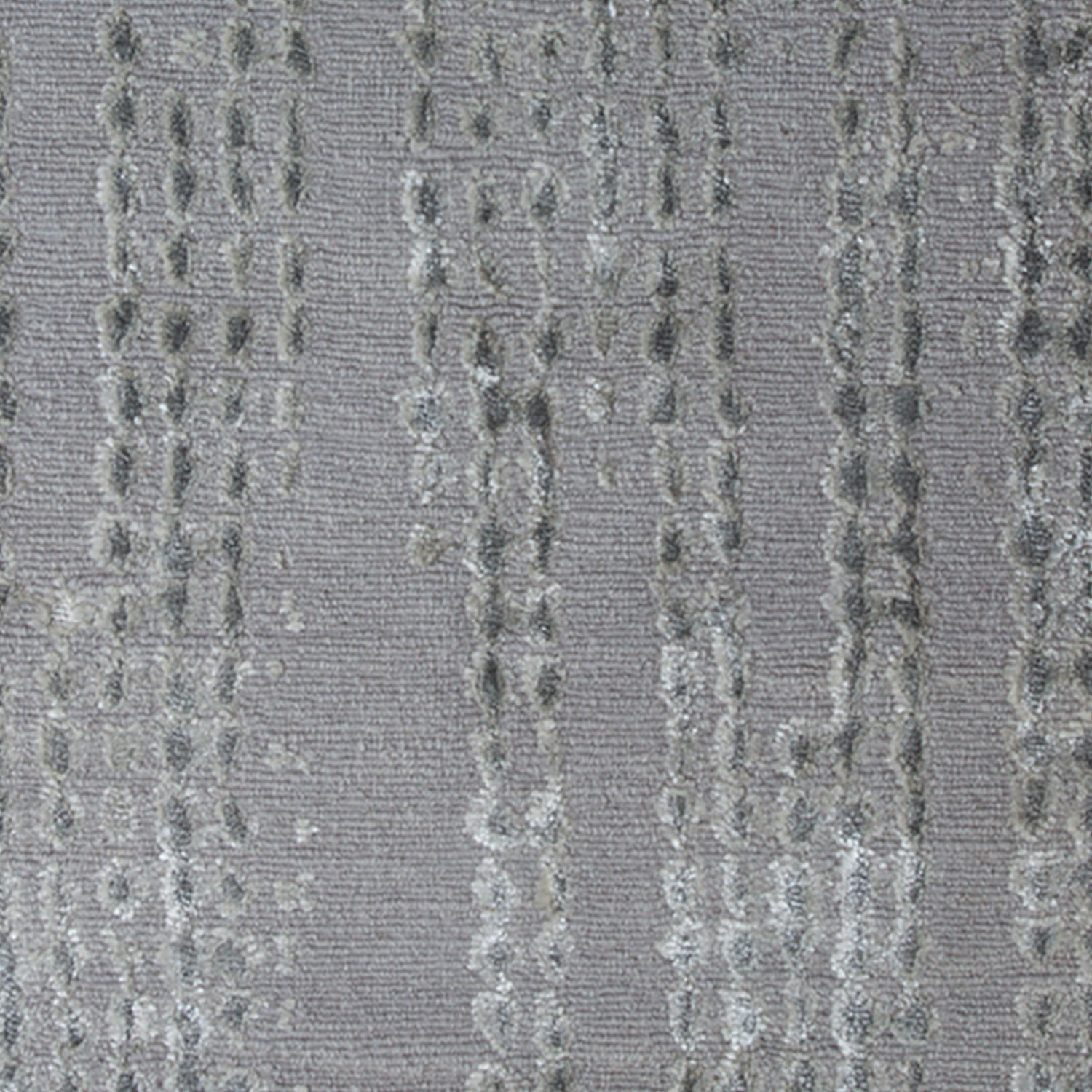 Woven high-pile rug swatch in gray with a repeating "raindrop" pattern in various shades of gray.
