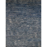 Rectangular rug in a mottled stripe print in shades of blue, black and gray.
