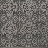 Woven rug swatch in a repeating floral paisley in shades of gray.