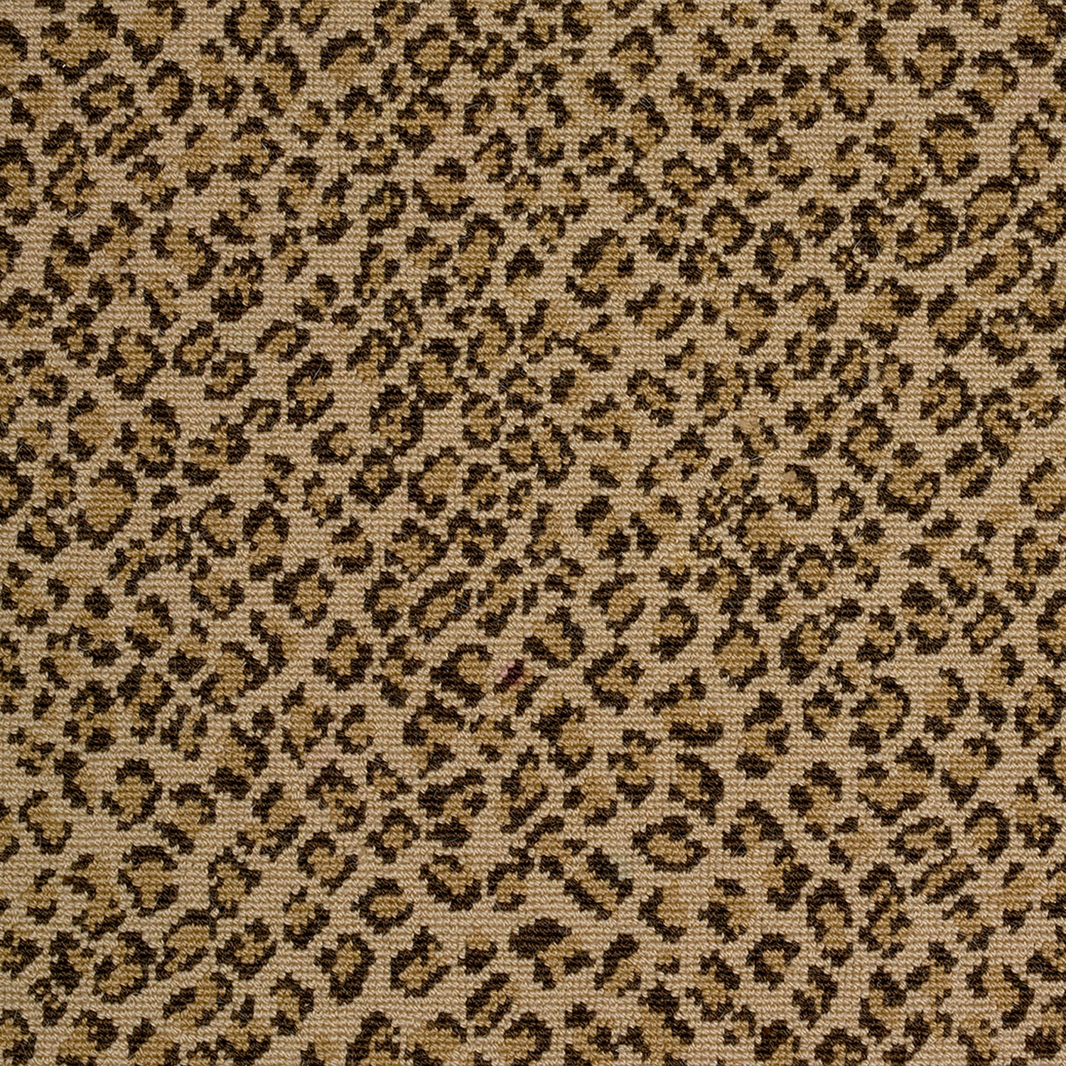 Wool-blend broadloom carpet swatch in a small scale animal print pattern in black and gold on a bronze field.