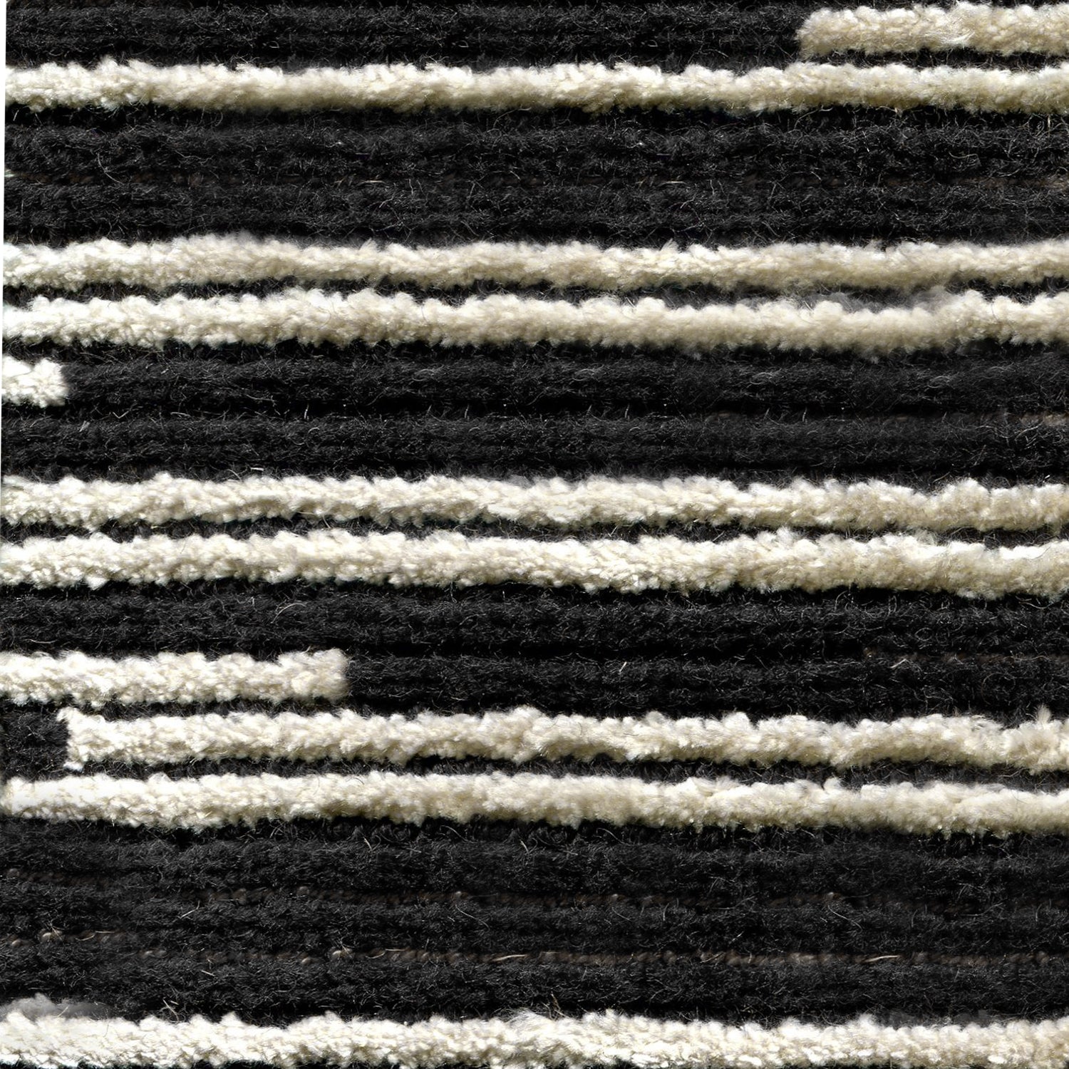 Wool-silk broadloom carpet swatch in a dimensional broken stripe pattern in black and white.