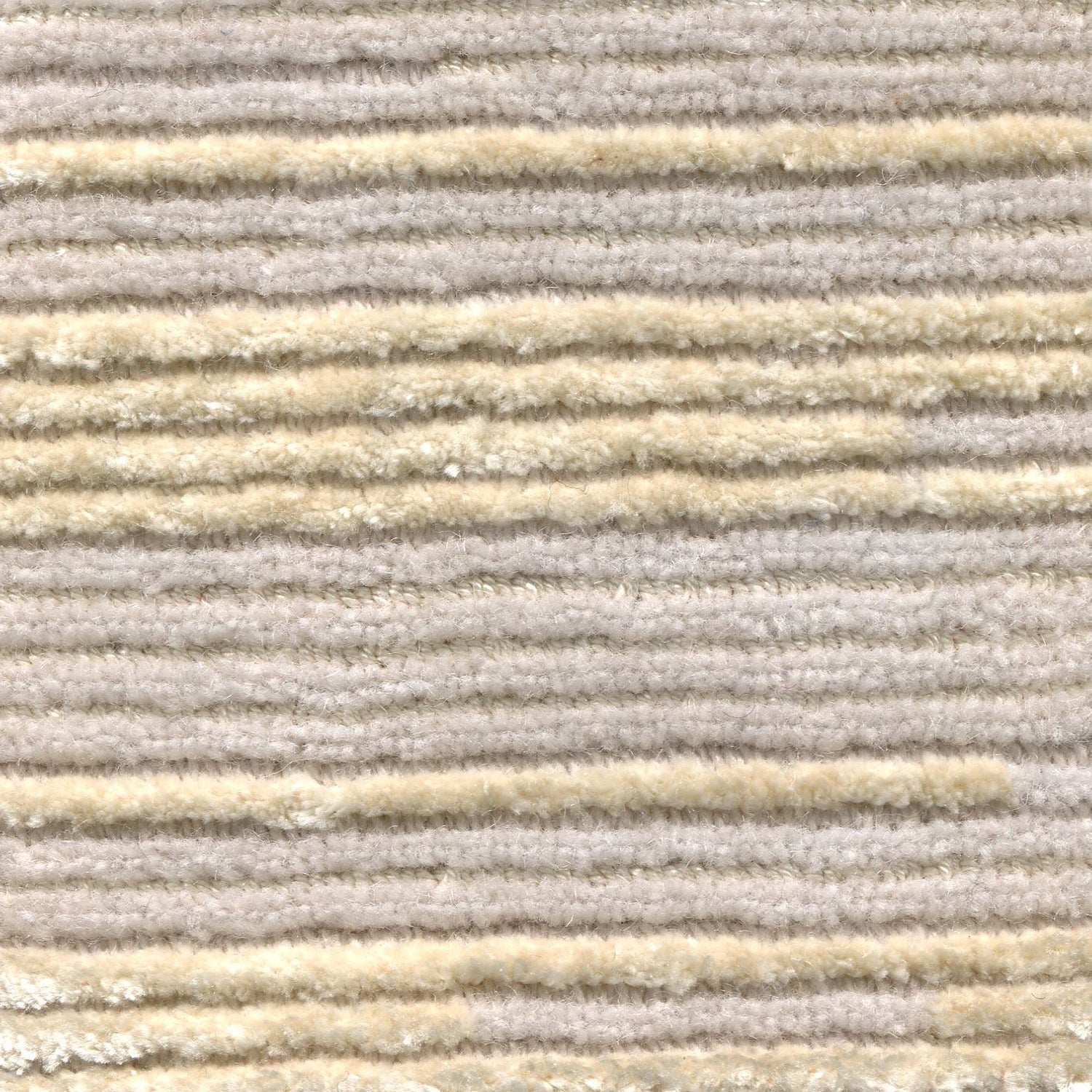 Wool-silk broadloom carpet swatch in a dimensional broken stripe pattern in silver and tan.