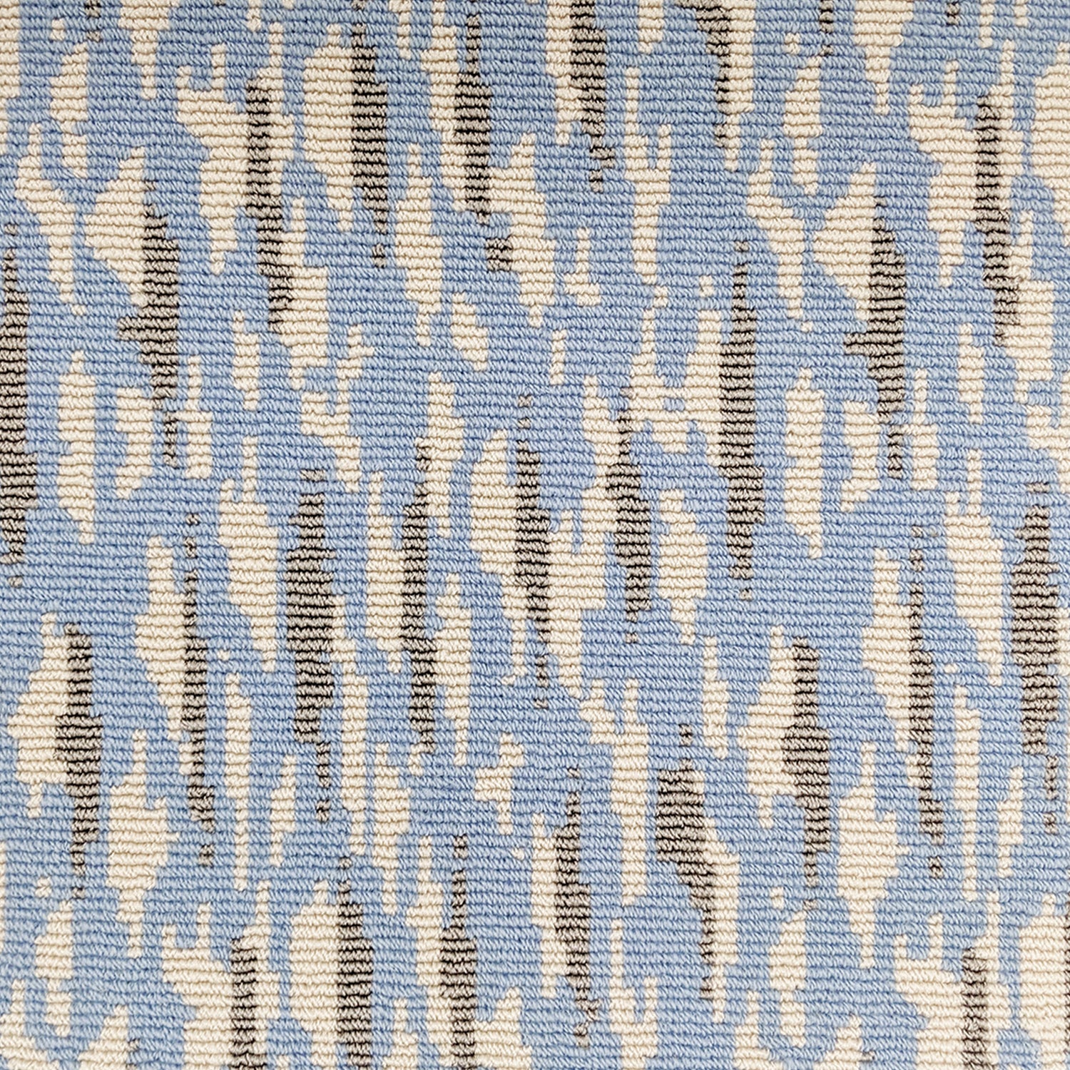 Wool-blend broadloom carpet swatch in a repeating abstract print in cream and gold on a sky blue field.