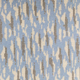 Wool-blend broadloom carpet swatch in a repeating abstract print in cream and gold on a sky blue field.