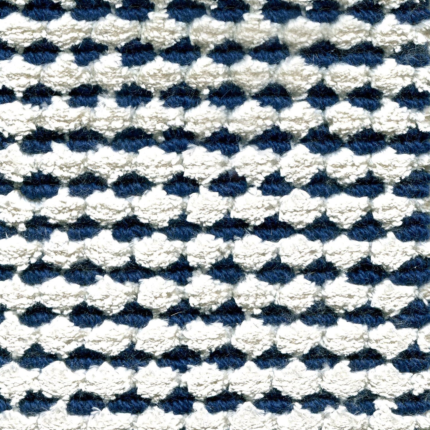 Wool-silk broadloom carpet swatch in a dimensional flat-and-tufted grid weave in white and navy.
