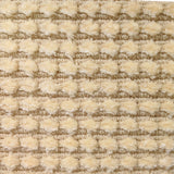 Wool-silk broadloom carpet swatch in a dimensional flat-and-tufted grid weave in tan.