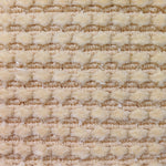 Wool-silk broadloom carpet swatch in a dimensional flat-and-tufted grid weave in cream.