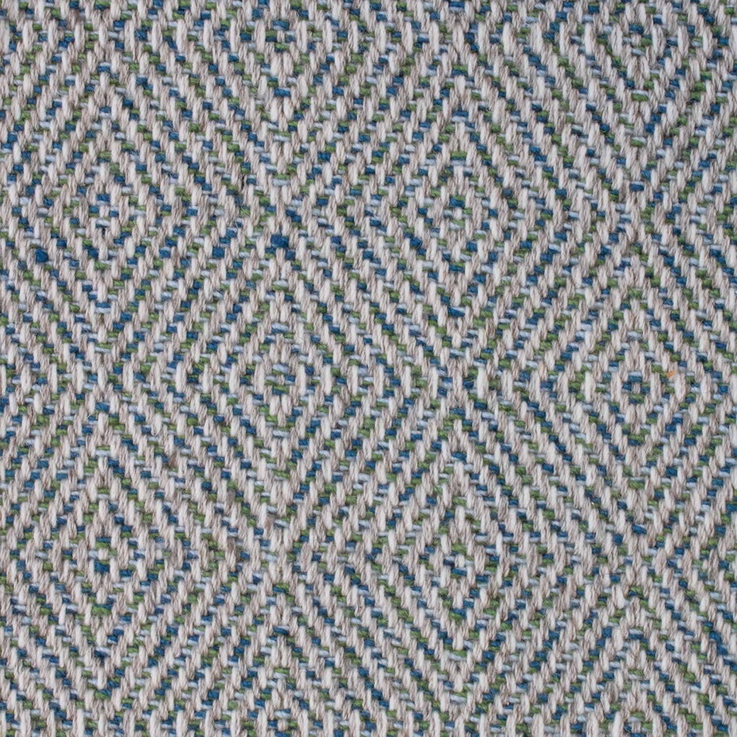 Wool-blend broadloom carpet swatch in a chunky diamond weave in mottled shades of cream, blue and green.