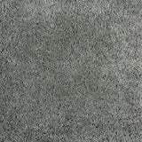 Synthetic broadloom carpet swatch in a cut pile texture in gray-green.