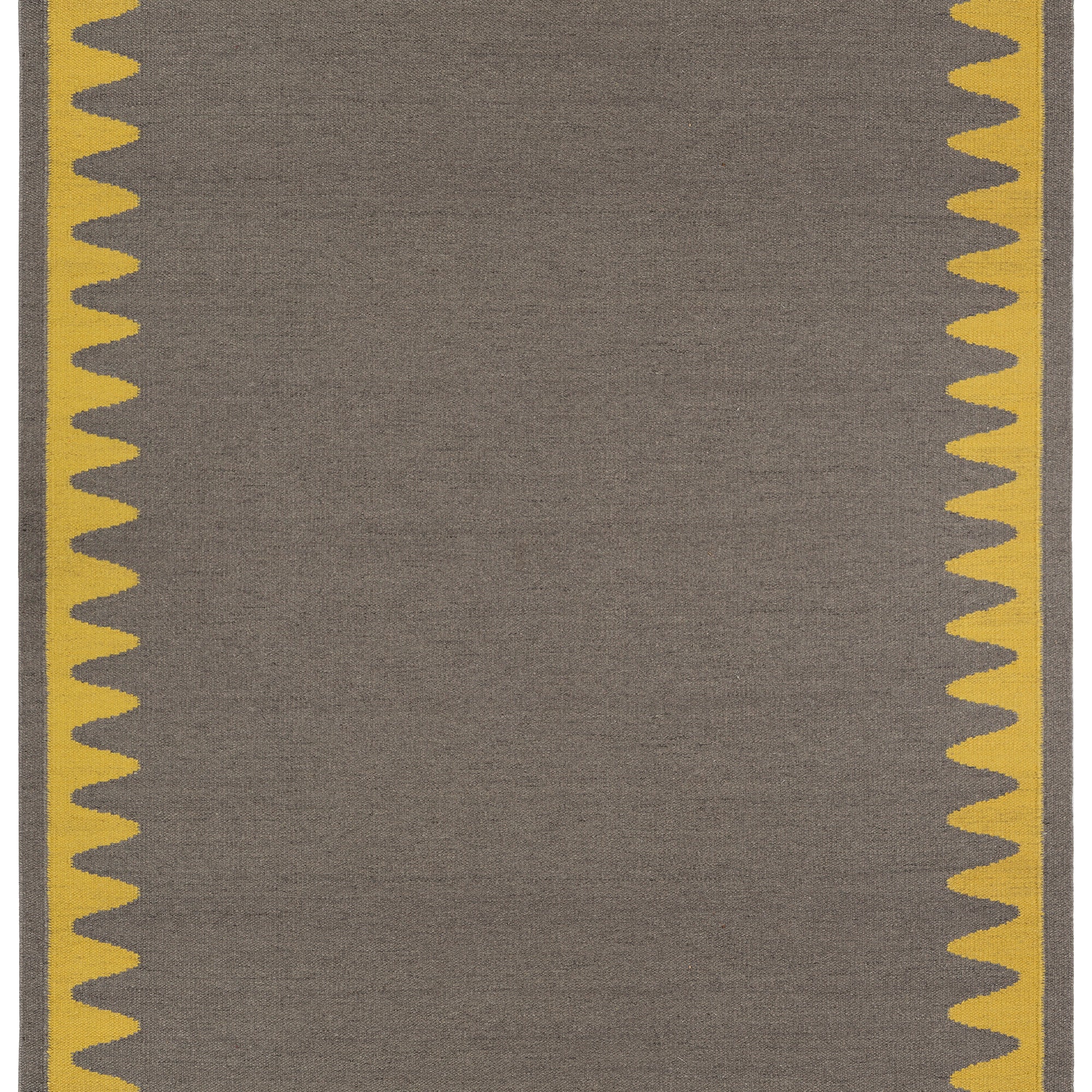 Waver Rug in Cardinal Yellow, a dark taupe field with a yellow flame stitch border. 