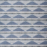 Swatch of linen fabric in a linear pattern with a sand dune-shaped triangle stripe motif in shades of navy, light blue and gray.