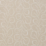 Woven fabric swatch with a large-scale repeating leaf print in white on a cream background.
